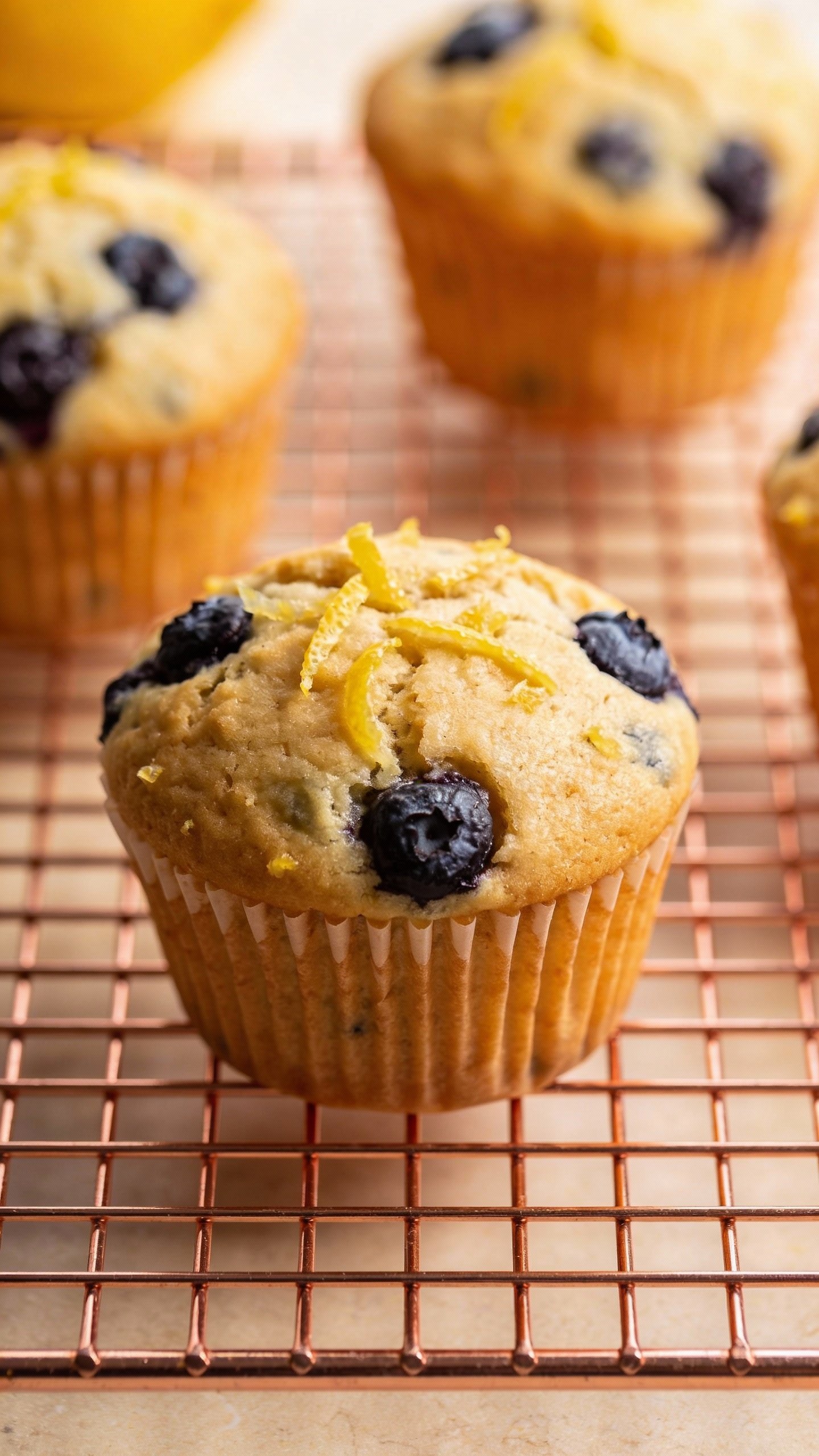 lemon-zested low-sugar blueberry muffin on cooling rack