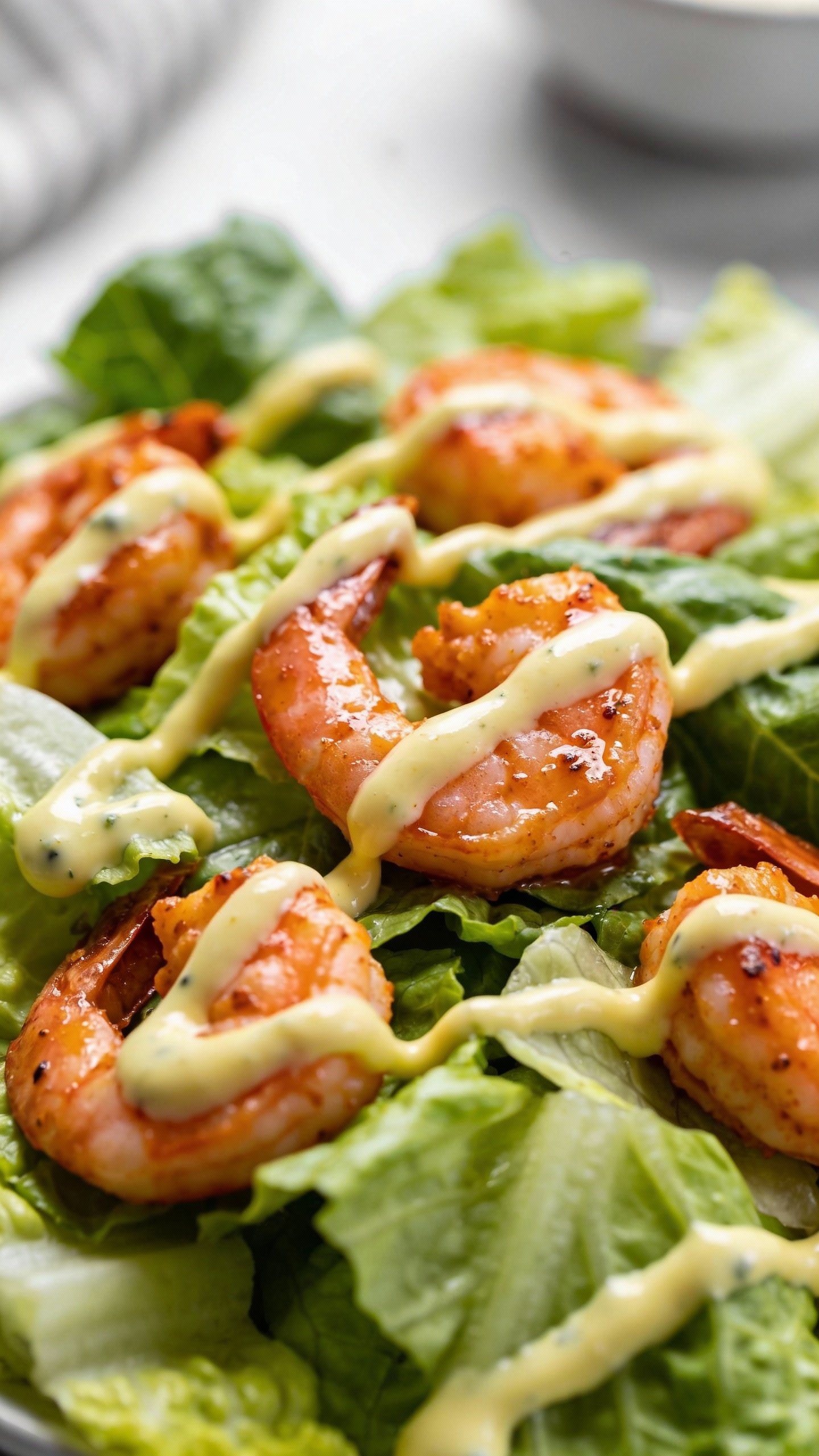drizzle of ranch over chopped romaine with buffalo shrimp