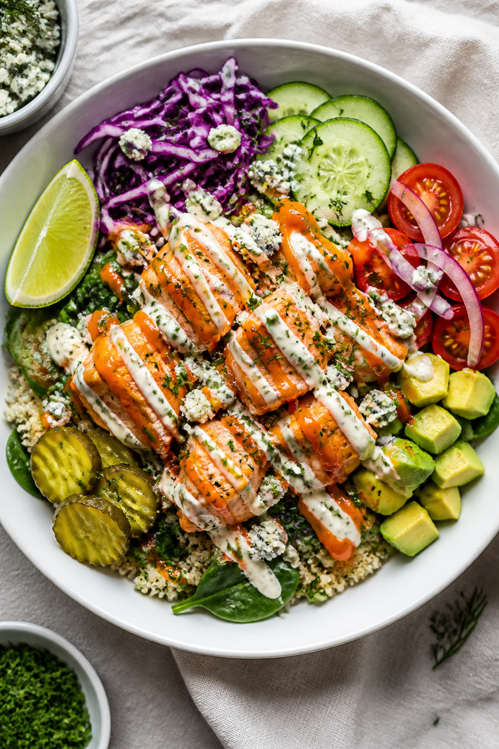 Final plated bowl: Beautifully assembled Healthy Buffalo Salmon Bowl in a wide, matte-white bowl—b