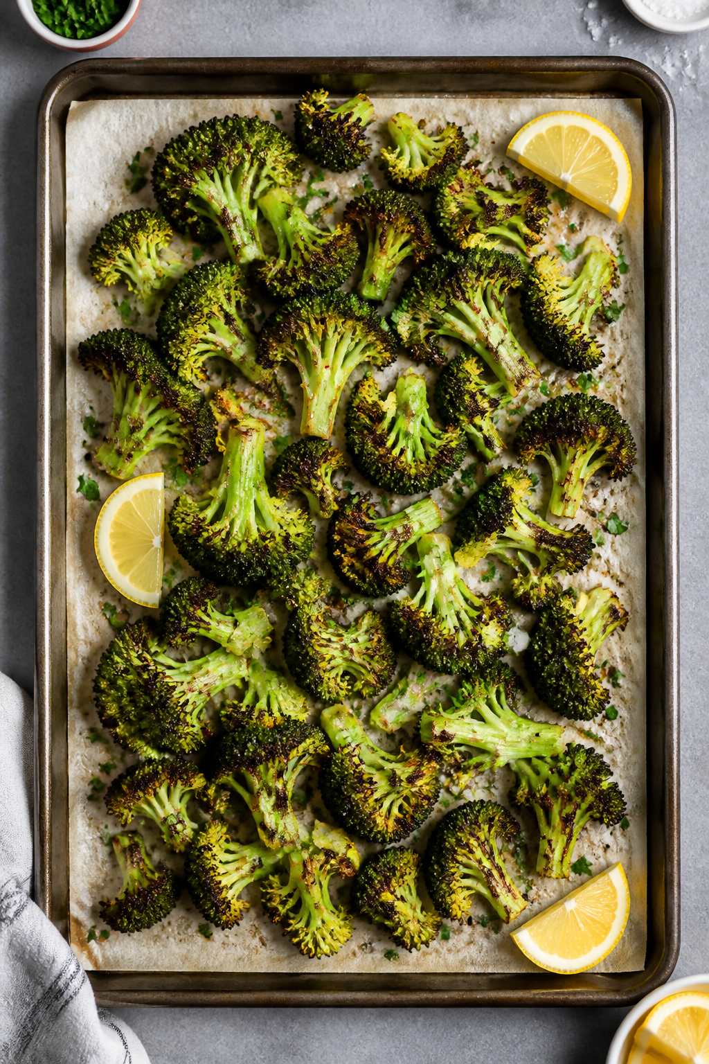 Tasty top view: Overhead shot of a sheet pan piled with roasted broccoli florets, edges deeply brown