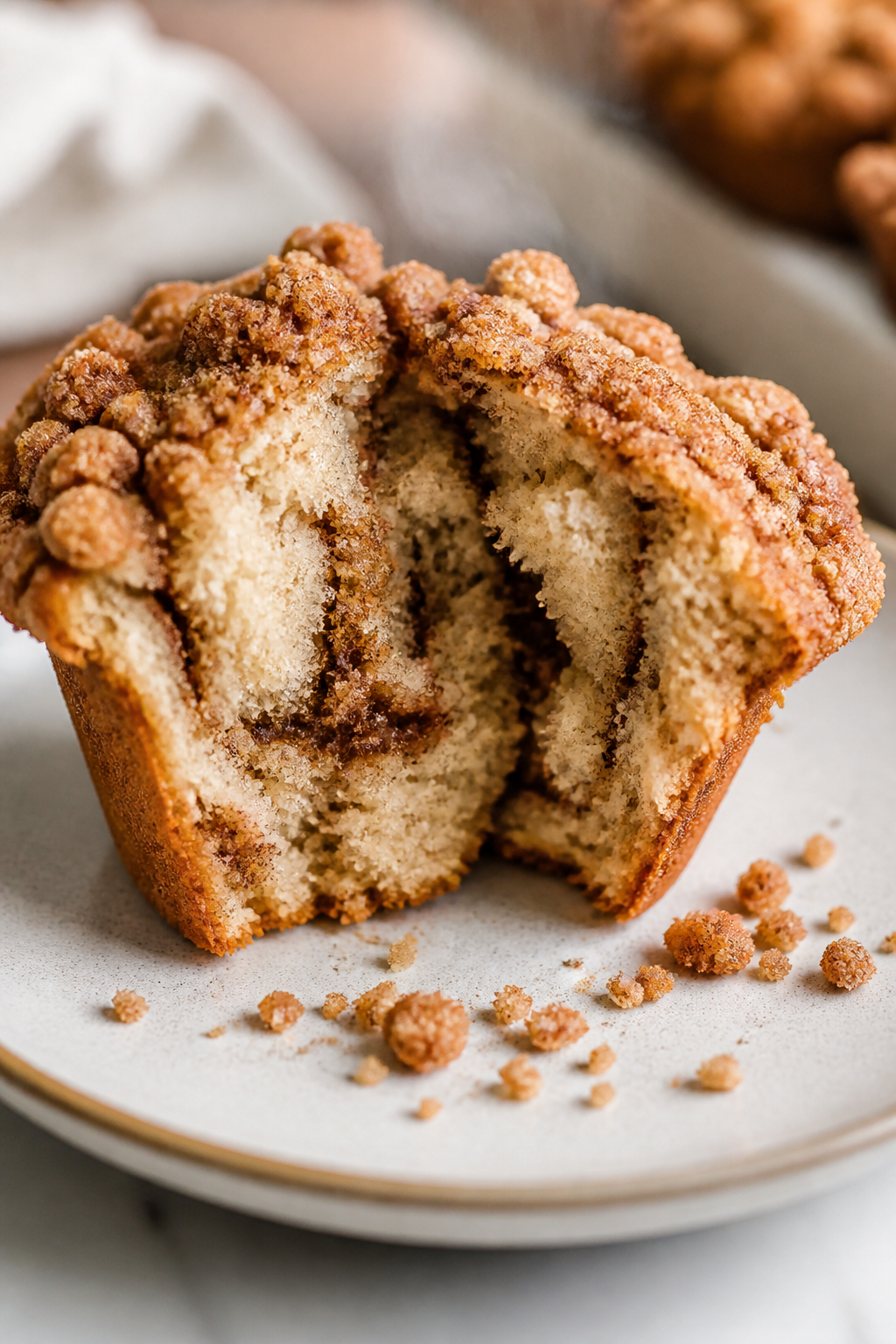 Close-up detail: Freshly baked protein coffee cake muffin torn open to reveal a moist, tender crumb 