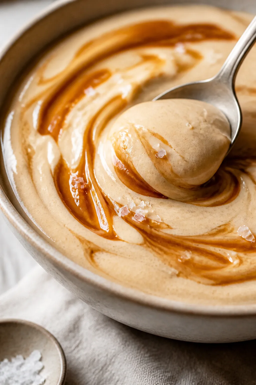 Close-up detail: Ultra-creamy Cottage Cheese Caramel Protein Pudding just after blending, spoon scoo