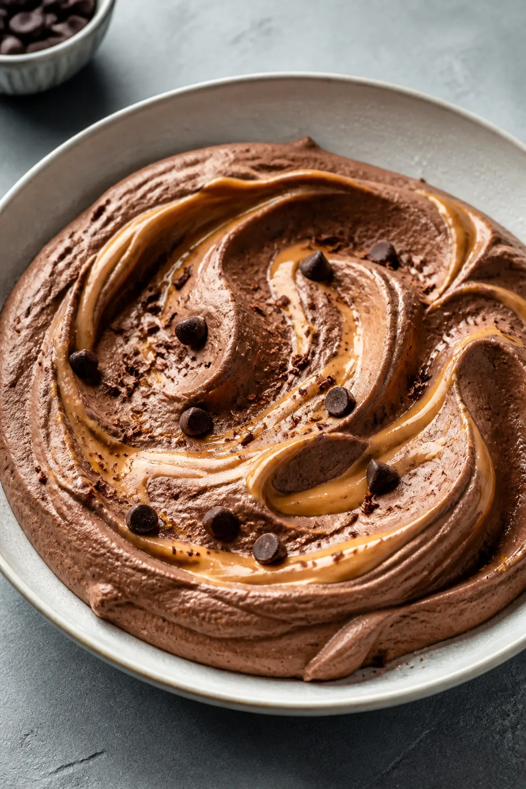 Final dish presentation: Beautifully plated Peanut Butter Swirl variation—chocolate protein mousse