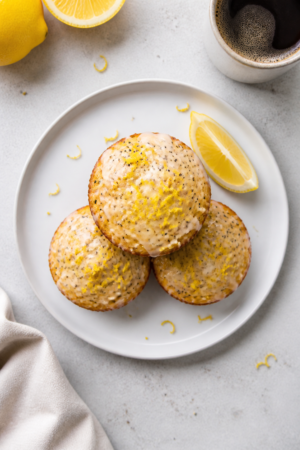 Final dish presentation: Restaurant-quality plate with three glazed lemon poppy seed protein muffins