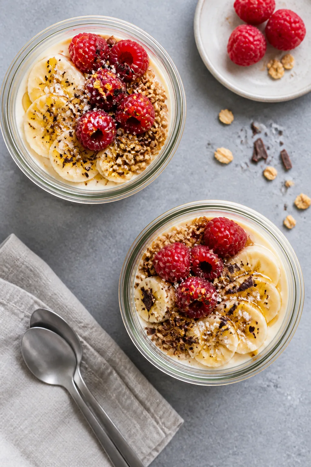 Overhead “tasty top view” of finished vanilla protein pudding portioned into two glass meal-prep