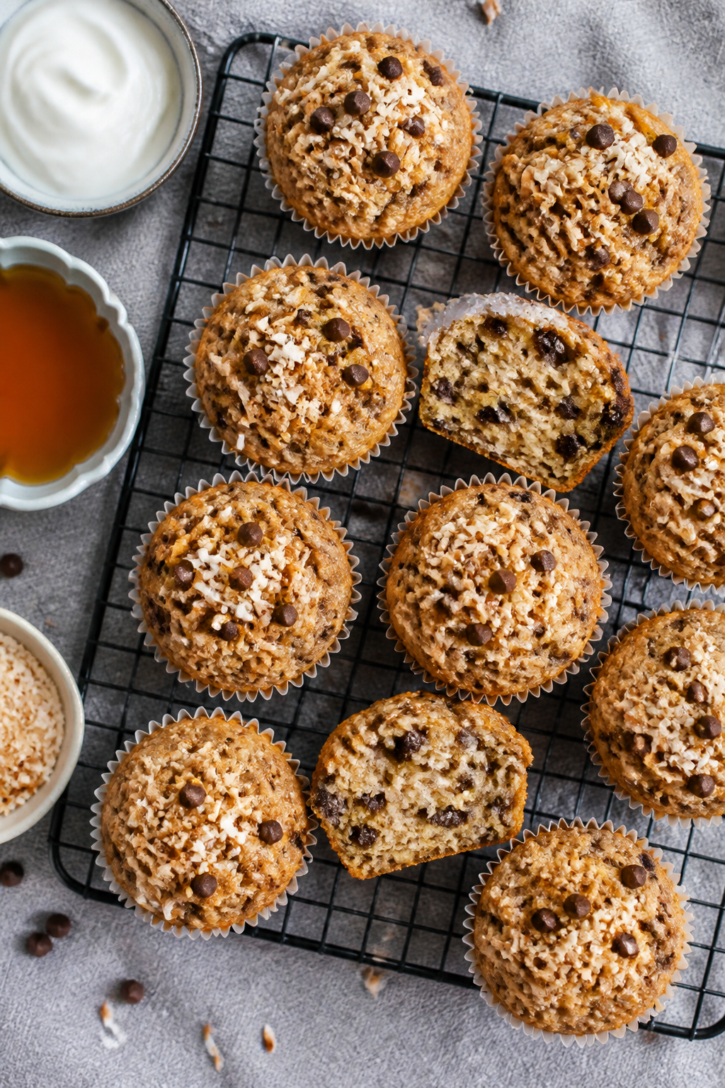 Tasty top view: Overhead shot of a cooling rack filled with muffins, some split open to reveal the s