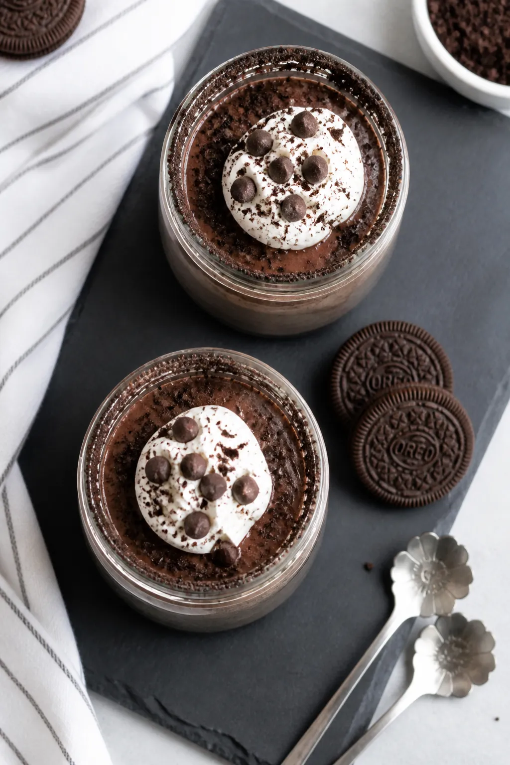 Tasty top view: Overhead shot of chilled High Protein Oreo Pudding portioned into two clear glass ja