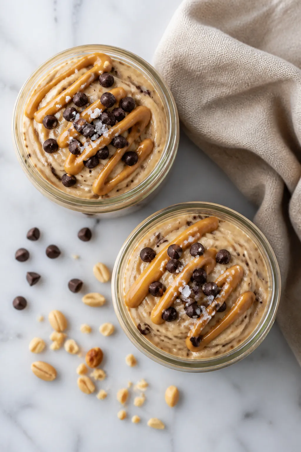 Tasty top view: Overhead shot of high protein cookie dough pudding swirled into two small glass jars