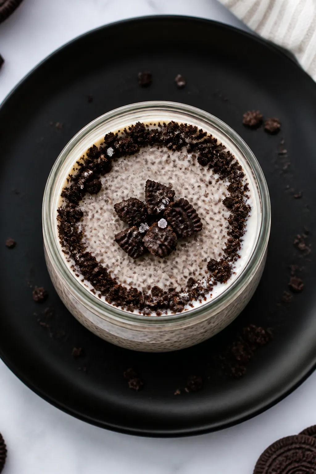 Tasty top view — Overnight set pudding ready to serve: Overhead shot of a short, clear jar filled 