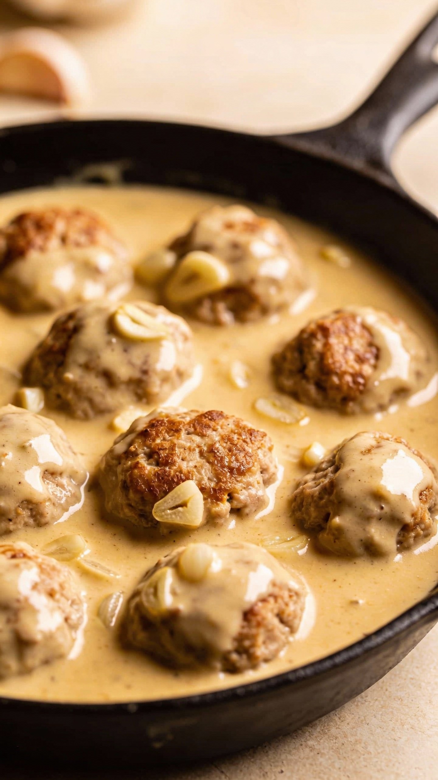 single skillet of turkey meatballs in garlicky cream sauce