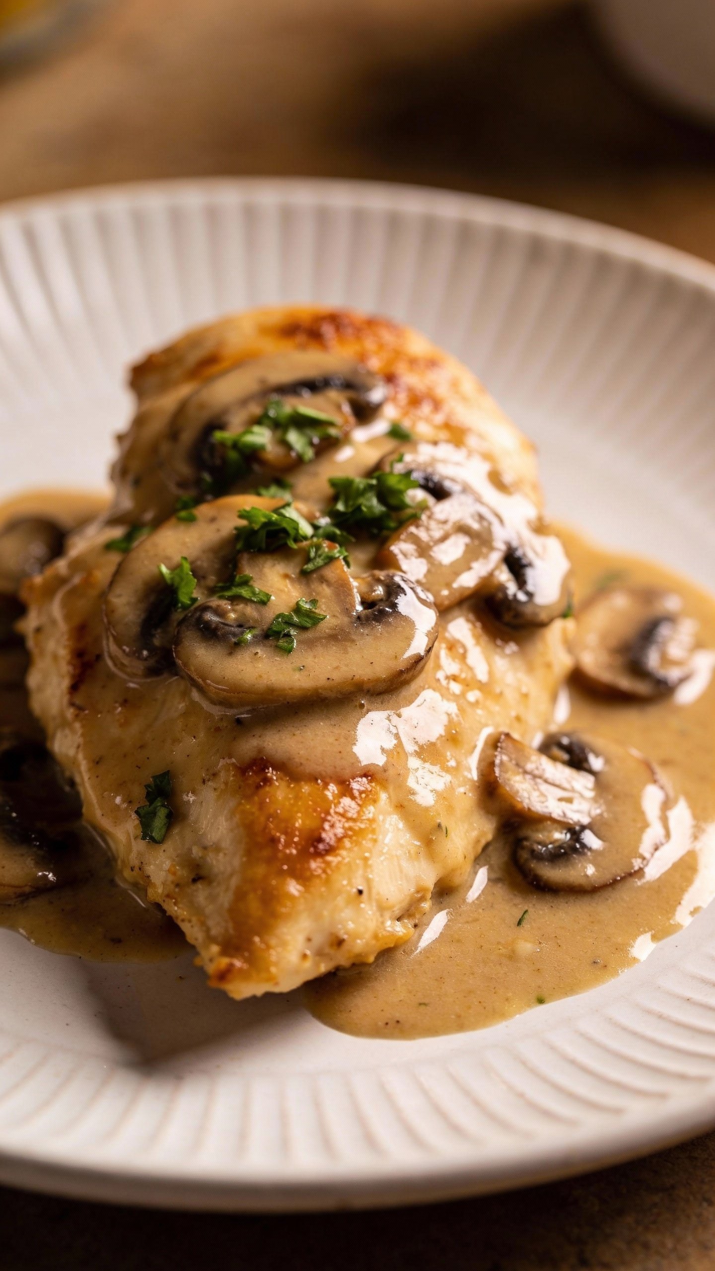 single plate of creamy mushroom chicken with pan sauce