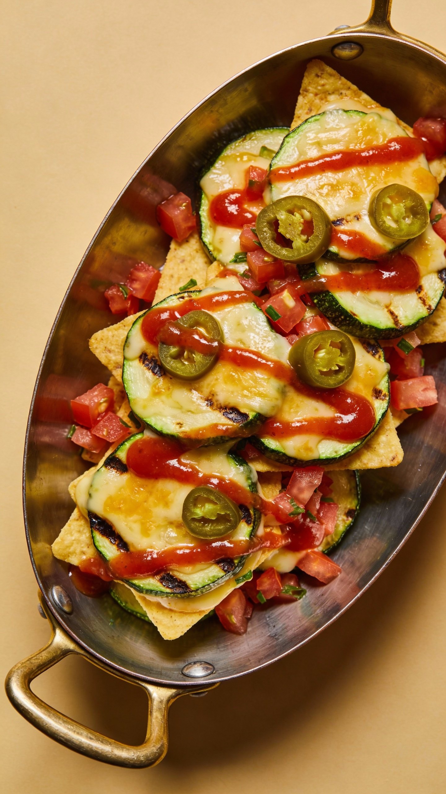 overhead plated zucchini nacho boat with salsa drizzle