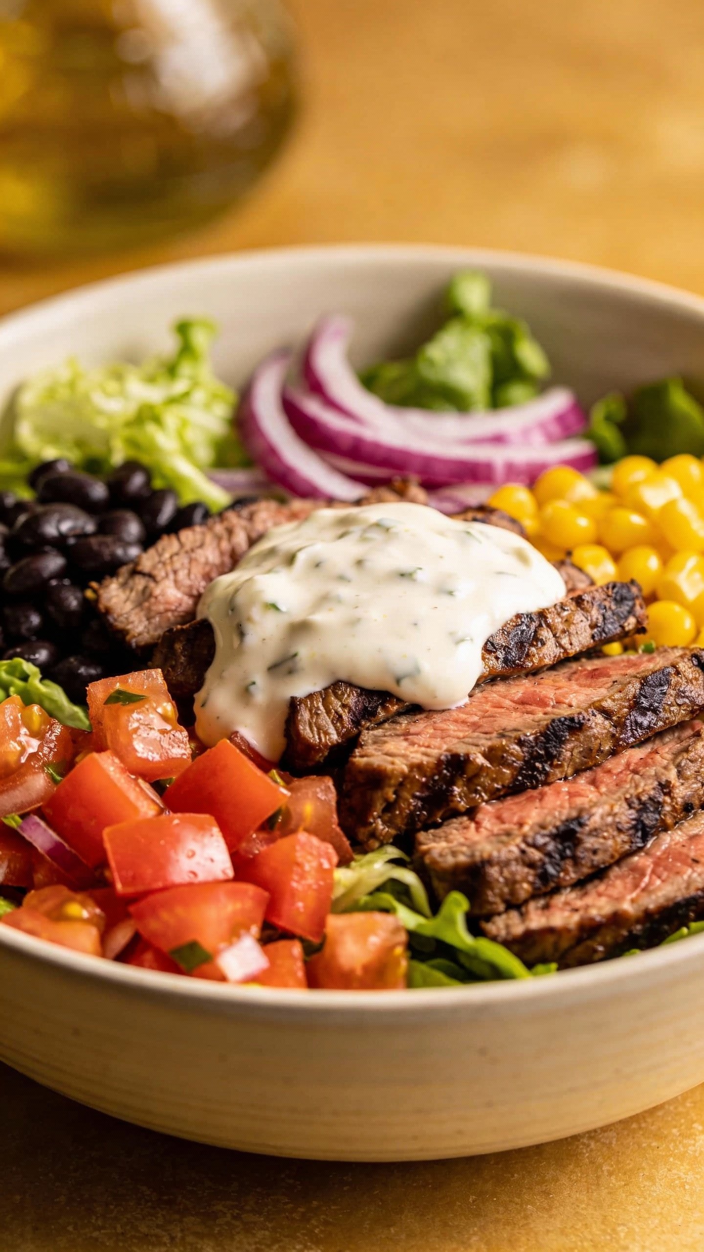 single bowl of southwest steak salad with creamy yogurt dressing