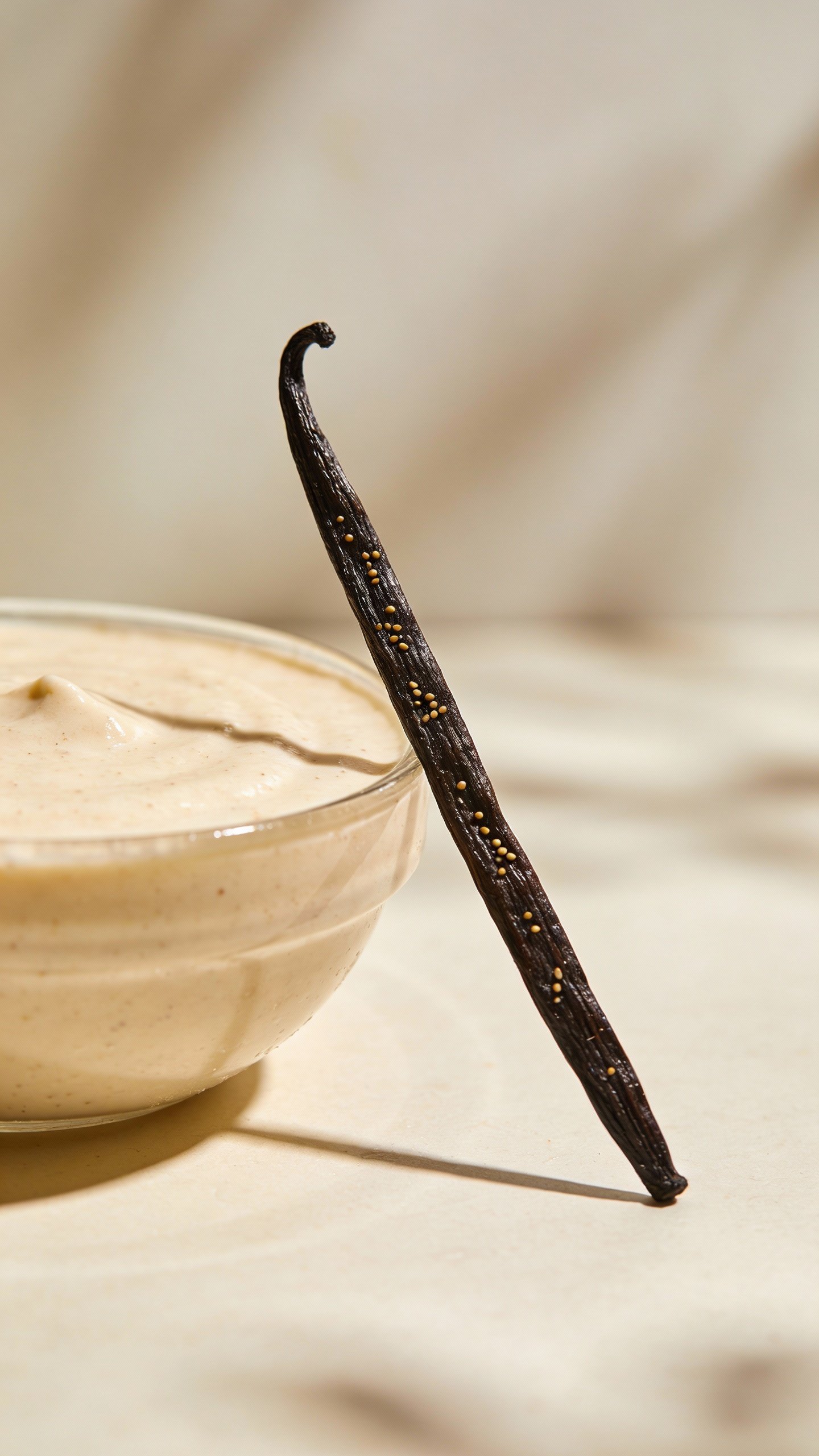 vanilla bean pod beside single smoothie bowl, shallow depth of field