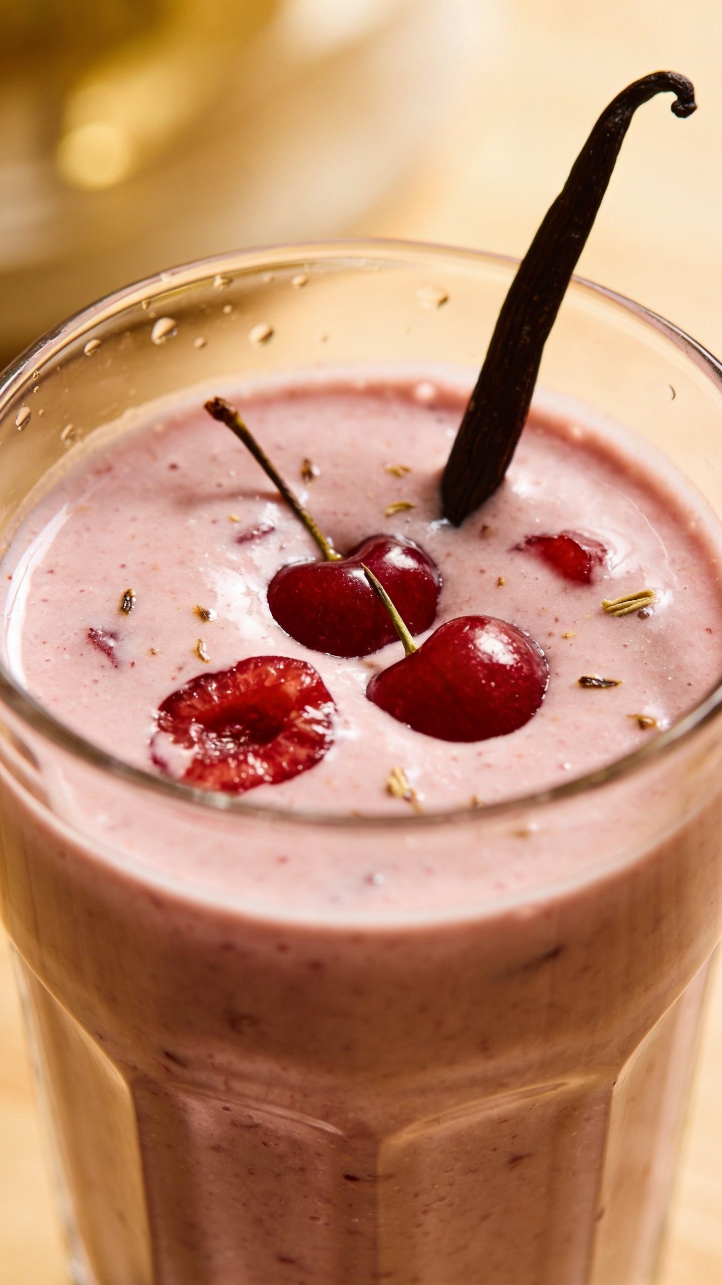closeup cherry vanilla smoothie in clear glass, soft morning light